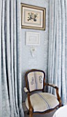DESIGNER JANE CHURCHILL : MAIN BEDROOM - WALL COVERED IN SAME FABRIC AS CURTAINS FROM JANE CHURCHILL INTERIORS. CHAIR COVERED WITH VINTAGE FRENCH LINEN  AT AN ANTIQUES MARKET