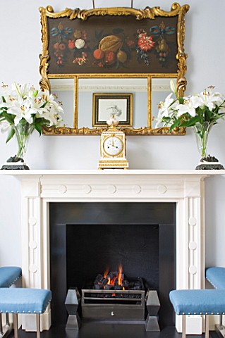 DESIGNER_JANE_CHURCHILL__THE_DRAWING_ROOM__MODERN_FIREPLACE_WITH_ANTIQUE_FRENCH_CLOCK__ANTIQUE_SHOP_