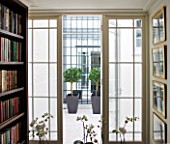 DESIGNER JANE CHURCHILL : VIEW FROM LIBRARY TO COURTYARD BEYOND