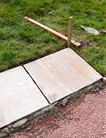 PAVING_PROJECT__DEVON__DESIGNER_CLARE_MATTHEWS__A_BED_OF_MORTAR_WITH_STONE_SLABS_LAID_ON_TOP