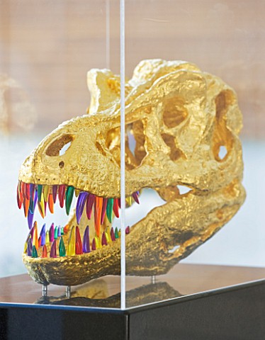 CAKE_BOY_HOUSE__LONDON_PERSPEX_AND_GUILDED_SKULL__KNOWN_AS_FRED__ON_PLINTH_IN_LIVING_ROOM__FROM_THE_