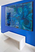 CAKE BOY HOUSE  LONDON: ENTRANCE HALL WITH BRIGHT BLUE WALL AND ABSTRACT PAINTING BY CONRAD LEACH