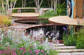 CHELSEA 2011 - RBC NEW WILD GARDEN DESIGNED BY NIGEL DUNNETT - REFLECTIVE POOLS TO CAPTURE RAINWATER AND SEAT