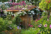 ANDRE EVE GARDEN  FRANCE - SHED WITH LIVING ROOF OF SEDUMS