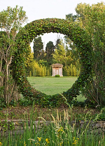 LES_CONFINES__PROVENCE__FRANCE__DESIGNER_DOMINIQUE_LAFOURCADE__VIEW_OF_FOLLY_FRAMED_BY_CIRCLE_OF_HED