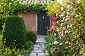 LES CONFINES  PROVENCE  FRANCE - DESIGNER: DOMINIQUE LAFOURCADE -  PATH WITH ROSES AND DOORWAY
