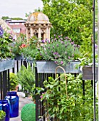 THE BALCONY GARDENER - ISABELLE PALMER - BALCONY FILLED WITH WINDOW BOXES AND CUPOLA BEYOND