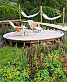 DECKING PROJECT - DESIGNER CLARE MATTHEWS - CIRCULAR DECK WITH WALKWAY  DECK CHAIRS AND HAMMOCKS