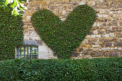 PRIEURE_NOTREDAME_DORSAN__FRANCE_CLIPPED_HEART_ON_WALL