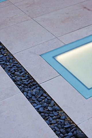DESIGNER_CHARLOTTE_ROWE__LONDON__PAVING_WITH_BLACK_COBBLES_AND_LIGHT_SET_INTO_PAVING