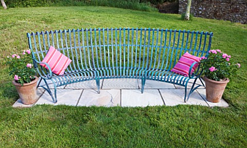 DESIGNER_CLARE_MATTHEWS__DEVON__PAVING_PROJECT_A_PLACE_TO_SIT_BLUE_PAINTED_METAL_BENCH_WITH_PINK_CUS