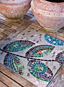 BARBARA KENNINGTON GARDEN  BRIGHTON: CONTAINERS ON THE PATIO TABLE WITH MOSAIC INSETS