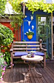 KARLA NEWELL GARDEN  BRIGHTON: SMALL TOWN GARDEN WITH BLUE WALL  WOODEN BENCH  TABLE AND DECKING