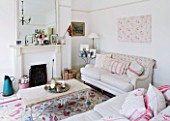AMANDA KNOX HOUSE  GRANTHAM: SHABBY CHIC SITTING ROOM - LINEN COVERED SOFAS  WALL PAINTED IN FARROW AND BALL  ALL WHITE  FRENCH MIRROR ON MANTELPIECE ABOVE FIRE