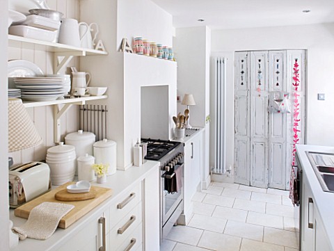 AMANDA_KNOX_HOUSE__GRANTHAM_THE_KITCHEN__WHITE_GALLEY_KITCHEN__PANTRY_AT_FAR_END_CONCEALED_BY_FRENCH