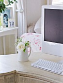 AMANDA KNOX HOUSE  GRANTHAM: THE LIVING ROOM - KIDNEY SHAPED 1920S DRESSING TABLE ACTS AS DESK WITH WHITE APPLE MAC AND JUG FILLED WITH WHITE ROSES FROM THE GARDEN