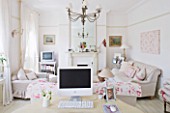 AMANDA KNOX HOUSE  GRANTHAM: THE WHITE LIVING ROOM - LINEN SOFAS WITH CUSHIONS HOME MADE BY AMANDA KNOX  WHITE APPLE MAC ON 1920S DRESSING TABLE. HOME OFFICE