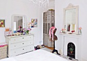 AMANDA KNOX HOUSE  GRANTHAM: BEDROOM WITH FRENCH FOLDING SHUTTERS  FIREPLACE WITH FRENCH MIRROR  OLD MANNEQUIN AND VINTAGE DRESS