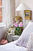 AMANDA KNOX HOUSE  GRANTHAM: WHITE BEDROOM WITH BED SIDE TABLE  LAMPSHADE  OLD PHONE AND TEDDY BEAR