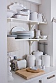 AMANDA KNOX HOUSE  GRANTHAM: WHITE KITCHEN WITH OPEN SHELVING AND WHITE TABLEWARE AND STORAGE JARS