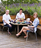 CHANTAL COADY AND HER HUSBAND JAMES  DAUGHTER MILLIE  12  ENJOYING AL FRESCO BREAKFAST ON THEIR ROOF TERRACE  SURROUNDED BY LAVENDER