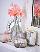 AMANDA KNOX HOUSE  GRANTHAM: FIREPLACE AND MIRROR IN BEDROOM WITH GLASS VASE WITH SWEET PEA -  LATHYRUS APRICOT QUEEN
