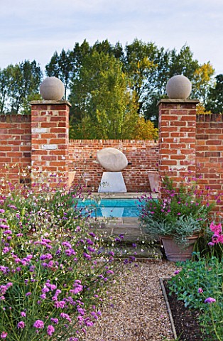 ULTING_WICK__ESSEX__VIEW_TO_SWIMMING_POOL_WITH_SCULPTURE_ANCASTER_ANGEL_BY_DOMINIC_WELCH