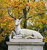 SALING HALL  ESSEX: A STONE STAG SCULPTURE AT THE EAST END OF CROSS WALK SURROUNDED BY AUTUMN COLOUR
