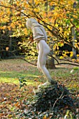 SALING HALL  ESSEX: STATUE IN THE WOODLAND IN AUTUMN