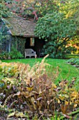 SALING HALL  ESSEX: THE WATER GARDEN IN AUTUMN WITH PRIVATE TEA HOUSE BHIND