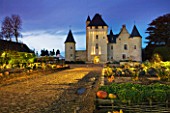 CHATEAU DU RIVAU  LOIRE VALLEY  FRANCE: VIEW OF THE CHATEAU LIT UP AT NIGHT WITH THE POTAGER IN THE FOREGROUND