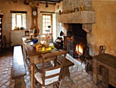 CHATEAU DU RIVAU  LOIRE VALLEY  FRANCE: THE KITCHEN WITH WOODEN TABLE AND FIRE
