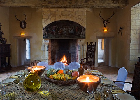 CHATEAU_DU_RIVAU__LOIRE_VALLEY__FRANCE_DINING_ROOM_IN_THE_CHATEAU_WITH_TABLE_LAID_AND_FIREPLACE