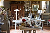 ROQUELIN  LOIRE VALLEY  FRANCE: SITTING ROOM - DISPLAY TABLE SET WITH NATURAL ARTEFACTS HELD UNDER GLASS CLOCHES  VIEW THROUGH TO DINING AREA