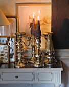 ROQUELIN  LOIRE VALLEY  FRANCE: DINING ROOM; COLLECTION OF MERCURY GLASS AND SILVER CANDLE STICKS.