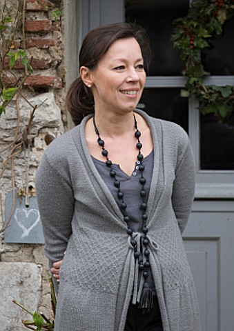 ROQUELIN__LOIRE_VALLEY__FRANCE_OWNER_ALINE_CHASSINE_OUTSIDE_THE_FRONT_DOOR_OF_THE_FARMHOUSE