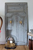 ROQUELIN  LOIRE VALLEY  FRANCE: MASTER BEDROOM; PORTABLE FAUX DOOR CLEVERLY HOLDS FITTED WALL LIGHTS