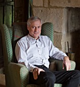 FULBROOK HOUSE: OWNER SIMON GILL SITS IN THE HALLWAY BESIDE THE FIRW