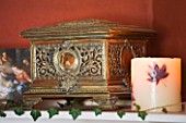 FULBROOK HOUSE: DINING ROOM SHELF WITH GOLDEN HUMIDOR AND MAPLE LEAF CANDLE.