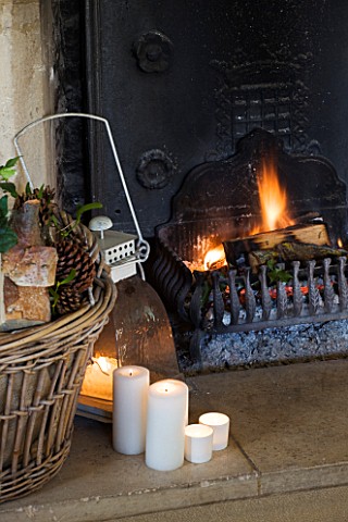FULBROOK_HOUSE_SITTING_ROOM__COTSWOLD_STONE_FIRE_HEARTH_WITH_ANTIQUE_IRON_FIRE_BACK_AND_GRATE__LOG_B