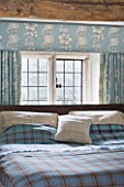 FULBROOK HOUSE: MASTER BEDROOM; BEAMED CEILING  AQUA PAINTWORK AND PRINTED LINEN CURTAINS COORDINATE WITH AQUA PLAID WOOL THROW FROM COTSWOLD WOOLLEN WEAVERS