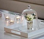 WHITE HOUSE: THE SITTING ROOM WITH WHITE CONTEMPORARY TRAY WITH GLASS ROSE CLOCHE OVER WINTER WHITE ROSE. GLASS TEA LIGHTS