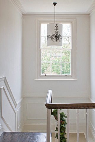WHITE_HOUSE_WHITE_PANELLED_AND_PAINTED_STAIR_WELL_WITH_CHANDELIER