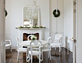 WHITE HOUSE: BREAKFAST ROOM: WHITE PAINTED TABLE AND CHAIRS  GLASS CHANDELIER AND WHITE FRAMED MANTLE MIRROR