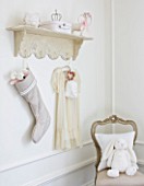 WHITE HOUSE: GIRLS BEDROOM - DECORATIVE SHELF HUNG WITH LINEN CHRISTMAS STOCKING AND PRETTY DRESS
