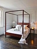 WHITE HOUSE: MASTER BEDROOM - WHITE WITH DARK WOODEN FLOORS  WOODEN CONTEMPORARY FOUR POSTER BED DRESSED IN WHITE BED LINEN
