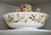 SARAH BAKERS HOUSE  THE OLD VICARAGE: BATHROOM: VINTAGE CERAMIC WASHBOWL FILLED WITH DRIED HYDRANGEA HEADS.