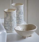 SARAH BAKERS HOUSE  THE OLD VICARAGE: BATHROOM; EMBOSSED CERAMIC  CUSTOM MADE BAKER AND GRAY BEAKERS WITH SOAP DISH.