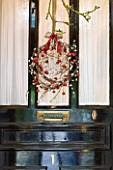 SARAH BAKERS HOUSE  THE OLD VICARAGE: FRONT DOOR DRESSED WITH BERRIED WREATH.