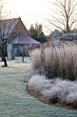 THE MANOR HOUSE  STEVINGTON  BEDFORDSHIRE. DESIGNER: KATHY BROWN - THE MONET BORDERS AT DAWN WITH FROST